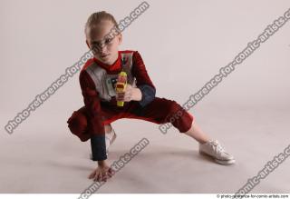 DENISA SITTING POSE WITH GUN